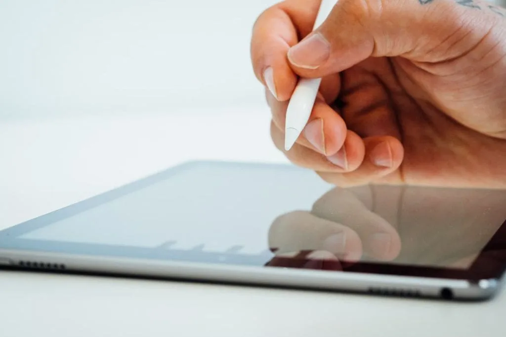 A patient signing a form